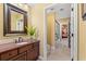 Bathroom boasts vanity with a stone countertop and a view into the bedroom and shower at 9547 Edgerton Dr. # 904, Myrtle Beach, SC 29572
