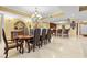 Elegant dining room with a stunning chandelier and open access to kitchen at 9547 Edgerton Dr. # 904, Myrtle Beach, SC 29572