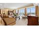 Spacious living room featuring floor-to-ceiling windows and tasteful furnishings at 9547 Edgerton Dr. # 904, Myrtle Beach, SC 29572