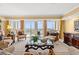 Bright living room with expansive windows offering beautiful views and elegant seating at 9547 Edgerton Dr. # 904, Myrtle Beach, SC 29572