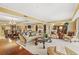 Open-concept living room, featuring a dining area, fireplace, and ample seating at 9547 Edgerton Dr. # 904, Myrtle Beach, SC 29572