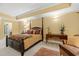 A well-decorated bedroom boasts a stylish bed, an antique desk, and a cozy armchair for relaxation at 9547 Edgerton Dr. # 904, Myrtle Beach, SC 29572