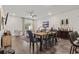 Open concept dining area with a wooden table and chairs, adjacent to living room at 97 Sea Shell Dr. # 33, Murrells Inlet, SC 29576