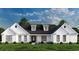 White farmhouse exterior with black roof and landscaping at 2176 Pettus Way, Surfside Beach, SC 29575