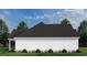 Side view of a white farmhouse with a black roof at 2176 Pettus Way, Surfside Beach, SC 29575