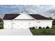 Three-car garage with white exterior and landscaping at 2184 Pettus Way, Surfside Beach, SC 29575