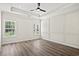 Spacious bedroom with wood-look floors and tray ceiling at 1021 Pisgah Church Rd., Aynor, SC 29511