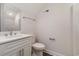 Bathroom with a marble vanity, decorative lighting, and a large mirror at 1033 Pisgah Church Rd., Aynor, SC 29511