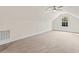 Large bonus room with carpeted floor and window at 1033 Pisgah Church Rd., Aynor, SC 29511