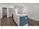 Kitchen island with a farmhouse sink, marble countertops and stainless steel dishwasher at 1033 Pisgah Church Rd., Aynor, SC 29511