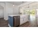 Kitchen island with a farmhouse sink, marble countertops and stainless steel dishwasher at 1033 Pisgah Church Rd., Aynor, SC 29511