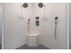Luxurious walk-in shower with dual shower heads, a built-in bench, and mosaic tile accents at 1033 Pisgah Church Rd., Aynor, SC 29511