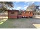 Brick home with brown siding and large backyard at 1043 Holt Rd., Conway, SC 29526