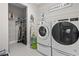 Laundry room with washer, dryer, and ample storage shelving at 1115 Prescott Circle, Myrtle Beach, SC 29577