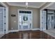 Bright entryway with hardwood floors and white door at 1204 Wading Heron Rd., North Myrtle Beach, SC 29582