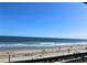 Relaxing beach view with people enjoying the sun at 1207 S Ocean Blvd. # 20207, Myrtle Beach, SC 29577