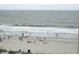 Beach with people swimming and relaxing at 1207 S Ocean Blvd. # 20207, Myrtle Beach, SC 29577