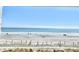 Oceanfront view with sandy beach and dunes at 1207 S Ocean Blvd. # 20207, Myrtle Beach, SC 29577
