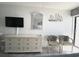 Living room features a large dresser and comfy chairs at 1207 S Ocean Blvd. # 20207, Myrtle Beach, SC 29577