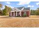 Brick house with front porch, walkway, and American flag at 1291 Pisgah Church Rd., Aynor, SC 29511