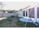 Backyard view showing a screened porch and patio area at 130 Lions Paw Ct., Loris, SC 29569