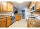 Modern kitchen with light wood cabinets, granite countertops, and stainless steel appliances at 130 Lions Paw Ct., Loris, SC 29569