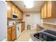 Bright kitchen featuring ample cabinetry, tiled flooring, and stainless steel appliances at 130 Lions Paw Ct., Loris, SC 29569