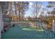 Green wooden deck with white railings, overlooking backyard at 134 Manor Circle, Myrtle Beach, SC 29588