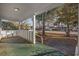 Green porch floor with white railings and view of street at 134 Manor Circle, Myrtle Beach, SC 29588