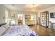 Bright bedroom with hardwood floors and large windows at 150 Black Water Dr., Murrells Inlet, SC 29576