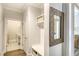 Bright entry hall with built-in bench, storage, and ornate mirror at 150 Black Water Dr., Murrells Inlet, SC 29576