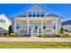 Gray two-story house with a front porch and landscaped yard at 150 Black Water Dr., Murrells Inlet, SC 29576