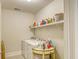 Laundry room with washer, dryer, and ample shelving at 150 Black Water Dr., Murrells Inlet, SC 29576