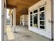 Covered back porch showcasing an open-air space and back windows at 1526 Bellini Ct., Myrtle Beach, SC 29579