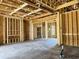 Spacious interior showcasing unfinished framing, open ceilings, and concrete floors at 1526 Bellini Ct., Myrtle Beach, SC 29579
