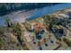 Aerial view of waterfront home, pool, dock, and landscaping at 2000 Hideaway Point, Myrtle Beach, SC 29579