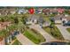Overhead view of home showcasing lush landscaping, long driveway, and neighborhood at 2000 Hideaway Point, Myrtle Beach, SC 29579