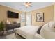 Bedroom boasts a neutral palette and TV at 2000 Hideaway Point, Myrtle Beach, SC 29579