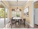 Charming breakfast nook with a round table and four chairs, near sliding glass doors at 2000 Hideaway Point, Myrtle Beach, SC 29579