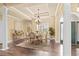 Formal dining room featuring hardwood floors, elegant lighting, and a classic design at 2000 Hideaway Point, Myrtle Beach, SC 29579