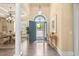 Inviting foyer features a view of the outdoors, elegant decor, and hardwood floors at 2000 Hideaway Point, Myrtle Beach, SC 29579