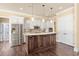 Elegant kitchen with a large island, stainless steel appliances, and custom cabinetry at 2000 Hideaway Point, Myrtle Beach, SC 29579
