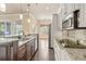 Bright kitchen with granite countertops, stainless steel appliances, and an open layout at 2000 Hideaway Point, Myrtle Beach, SC 29579