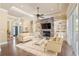 Comfortable living room featuring a stone fireplace, built-in bookshelves, and neutral decor at 2000 Hideaway Point, Myrtle Beach, SC 29579