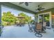 Spacious covered patio with multiple seating areas and ceiling fans at 2000 Hideaway Point, Myrtle Beach, SC 29579