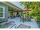 Large covered patio with lounge chairs, dining, and grilling area at 2000 Hideaway Point, Myrtle Beach, SC 29579