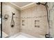 Detailed view of the shower's tilework, multiple shower heads, and built-in niches at 2000 Hideaway Point, Myrtle Beach, SC 29579