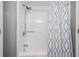 Clean bathroom with shower/tub combo and patterned curtain at 210 75Th Ave N # 4011, Myrtle Beach, SC 29572