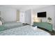 Two twin beds, dresser, and ocean view from the bedroom at 210 75Th Ave N # 4011, Myrtle Beach, SC 29572