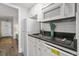 Small galley kitchen with white cabinets and granite at 210 75Th Ave N # 4011, Myrtle Beach, SC 29572